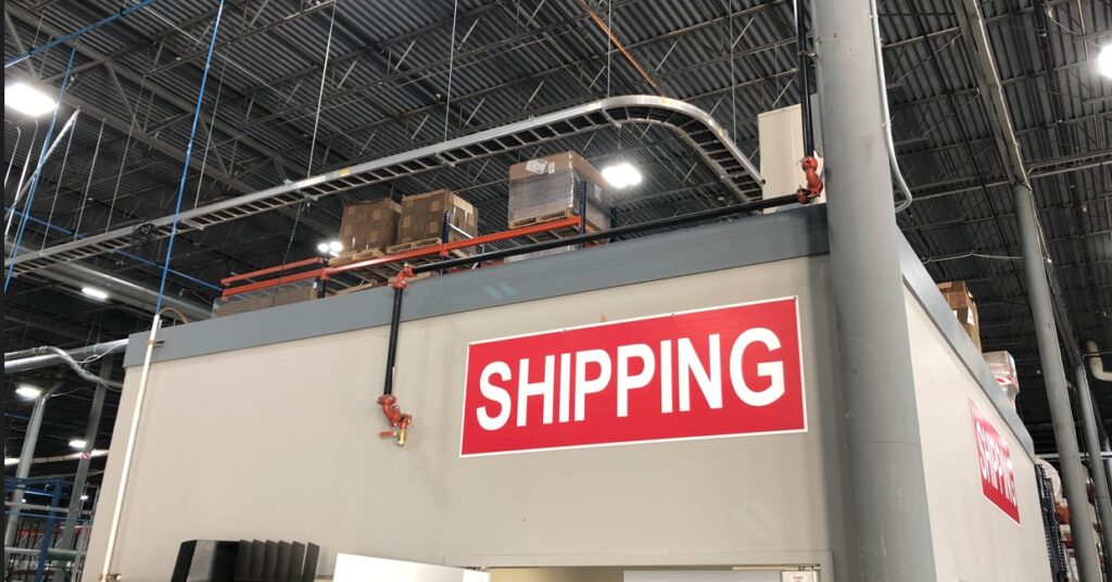 A shot of a "SHIPPING" warehouse label.